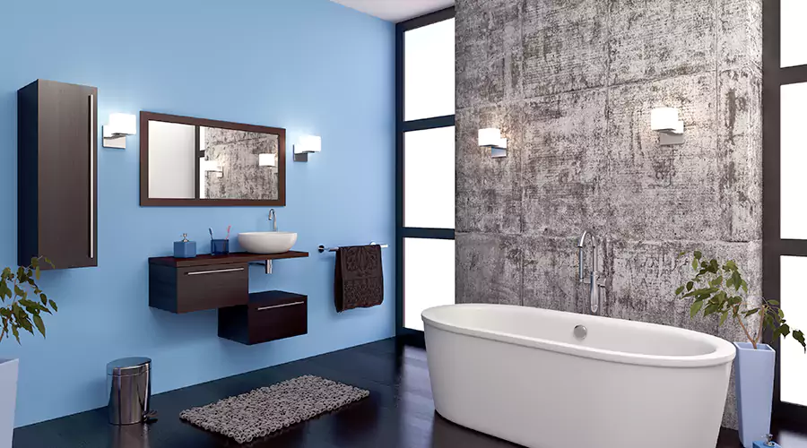 Modern Bathroom With Blue Walls, Freestanding Tub, and Sleek Vanity